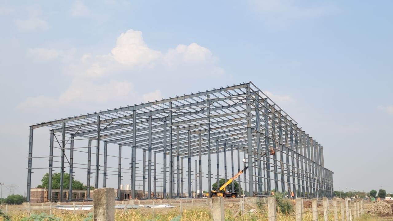 PEB steel frame under construction on an active Ffortune site
